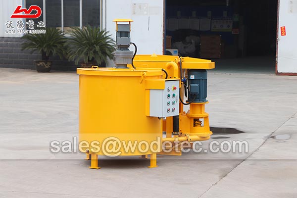 Adjustable cement grout mixer and agitator for deep well casing