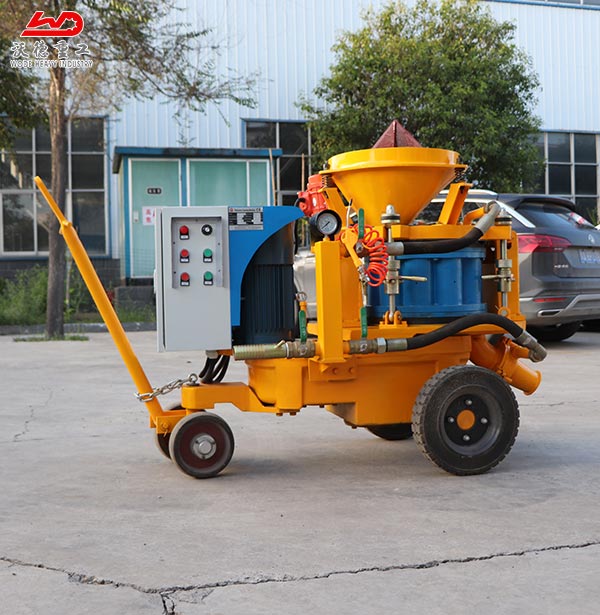 Castable refractory gunite machine for soil nailing