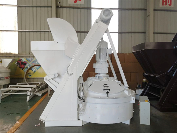 Self loading vertical shaft concrete mixer